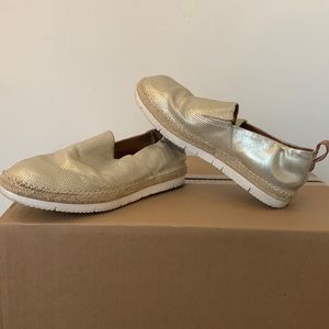 Women’s gold Kenneth Cole slip ons